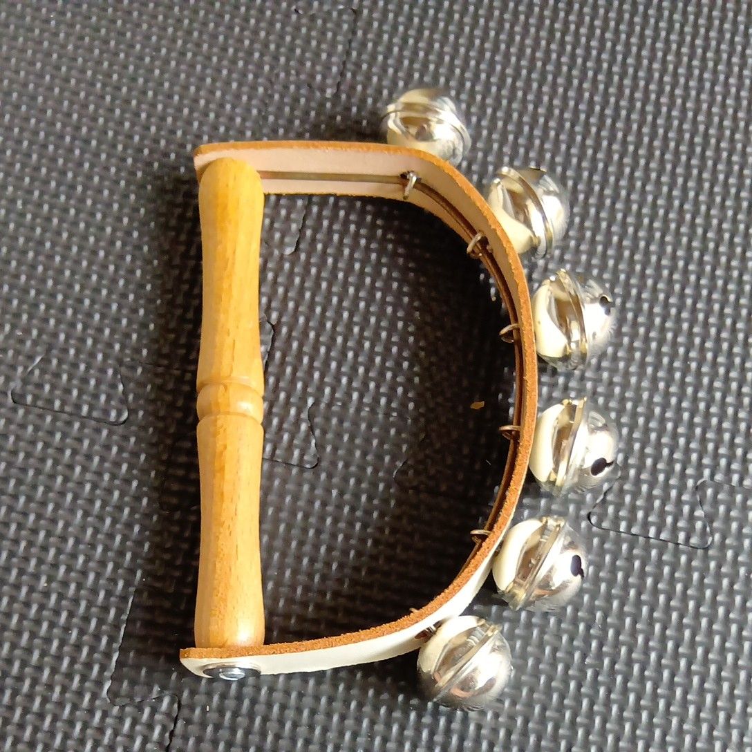 Wooden handle, with bell, percussion instrument, made by Sonar.